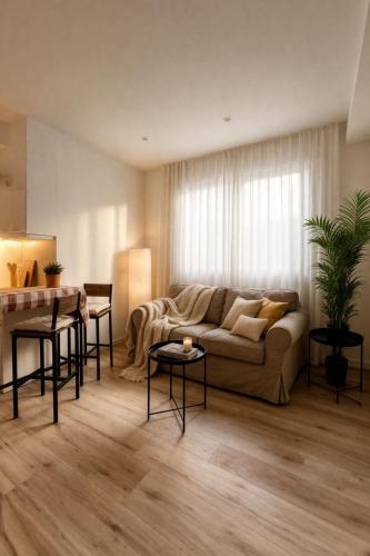 a living room with a couch and a table at Apartament a Sant Celoni, Montseny, Barcelona in Sant Celoni