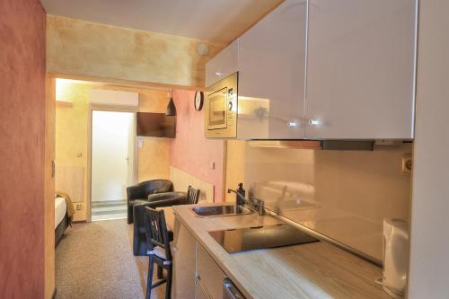 a kitchen with a sink and a counter top at U Admirala in Kladno