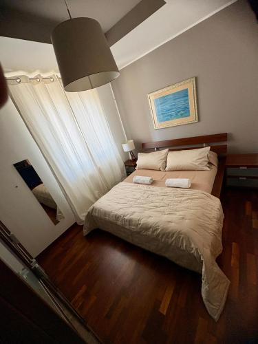 a bedroom with a bed with two towels on it at B&B Da Vinci in Cassano delle Murge