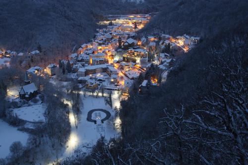 an aerial view of a town in the snow at night at Ferienwohnungen Schenk Schmitz in Bad Bertrich