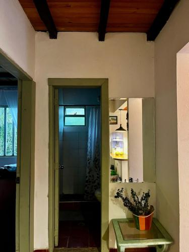 a room with a door leading to a kitchen with a table at Tu Refugio en el Campo in San Francisco