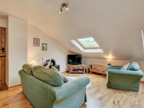 a living room with two couches and a tv at Bilbrook- Ukc4913 in Timberscombe