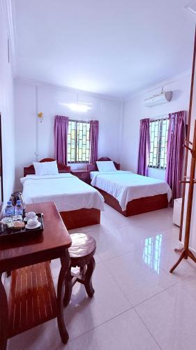 Llit o llits en una habitació de Angkor Sandra Villa
