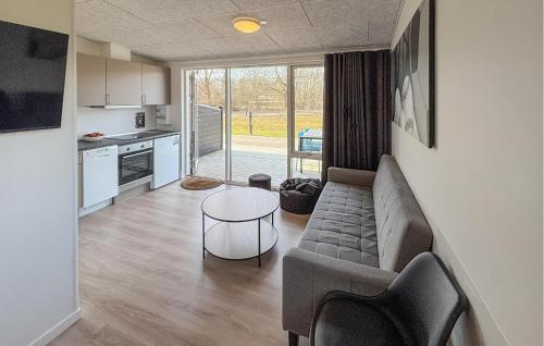 a living room with a couch and a table at 2 Bedroom Nice Apartment In Vejen in Vejen