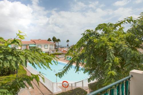 Výhled na bazén z ubytování Los Cabosos 40, Pasito Blanco, Gran Canaria nebo okolí