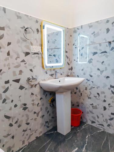 a bathroom with a sink and a mirror at NRS Villa Midigama in Midigama East