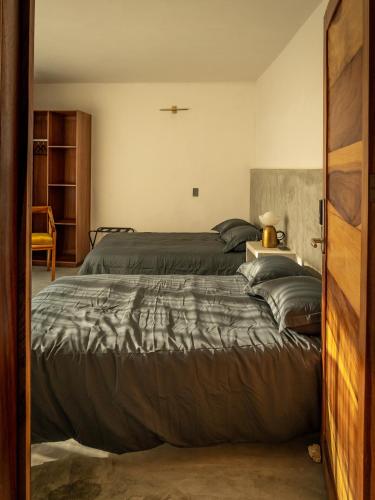 a bedroom with a large bed in a room at Eloína Hotel Boutique in Chiapa de Corzo
