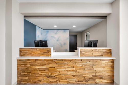a rendering of a hair salon with a stone wall at ECHO Suites Extended Stay by Wyndham Colorado Springs Airport in Colorado Springs
