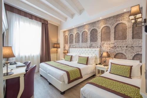 Postel nebo postele na pokoji v ubytování Hotel San Pietro