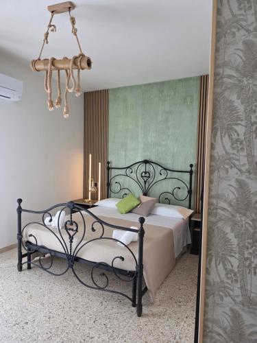 a bedroom with a bed and a mirror at Casa a Pennello Bed & Breakfast - Dove l'arte incontra l'ospitalità in San Benedetto del Tronto