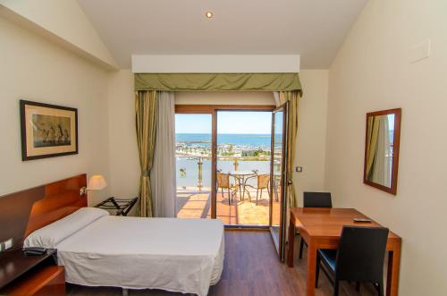 Posteľ alebo postele v izbe v ubytovaní Hotel Apartamento Martín Alonso Pinzón