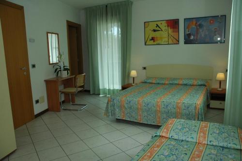 Postel nebo postele na pokoji v ubytování Appartamenti Vacanza Albatros
