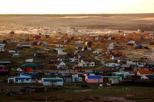 a small town in the middle of a field at cabopolonioalojamiento in Cabo Polonio