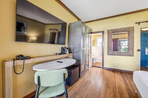 a bathroom with a sink and a mirror at Inn Marin and Suites, an Ascend Collection Hotel in Novato