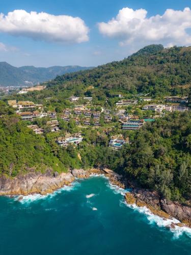 an aerial view of a resort on a hill next to the ocean at Ayara Kamala Resort & Spa - SHA Extra Plus in Kamala Beach