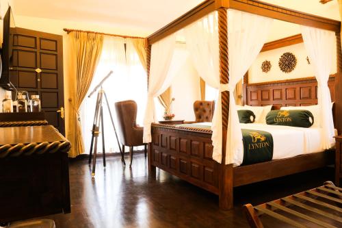 a bedroom with a canopy bed and a window at Lynton Resorts in Kotagiri