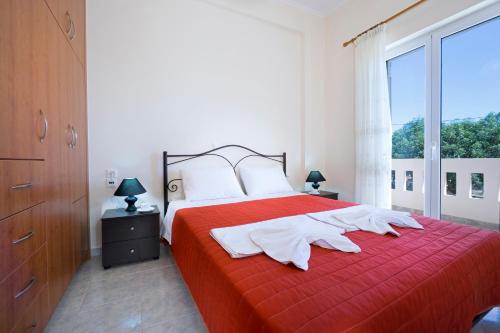 Кровать или кровати в номере Skamagkas M. Apartments