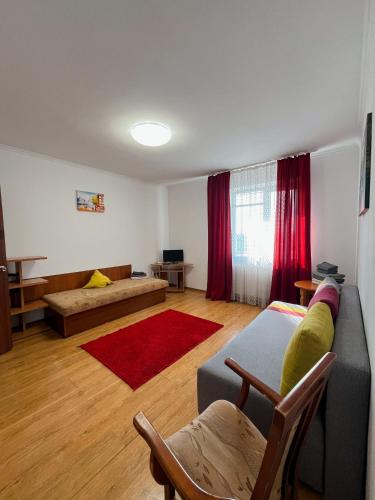 a living room with a couch and a table at Apartments Domovik on Beregovskaya 3 in Mukacheve