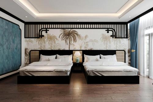 a bedroom with two beds and a wall with palm trees at Đại Cồ Việt Hotel Ninh Bình in Kỳ Vĩ