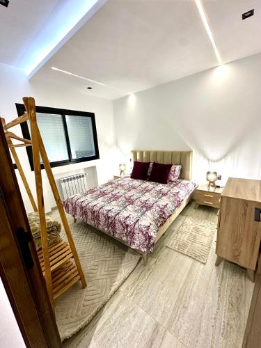 a bedroom with a bed and a staircase in it at Apartment in Sousse in Sousse