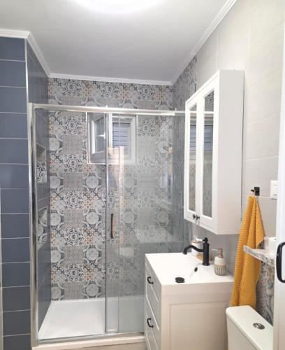 a bathroom with a shower and a sink at Holiday Home Roza in Mirce
