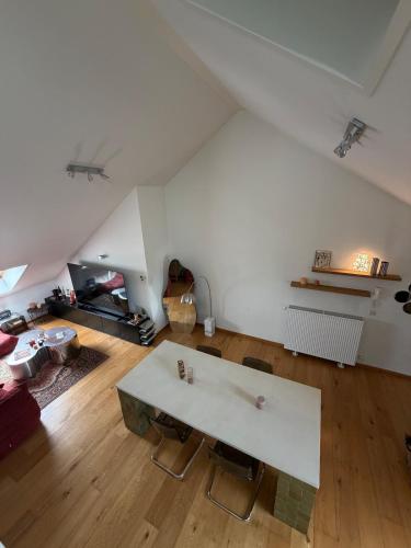 a living room with a white table in a room at Cosy Studio in Mechelen by Studio Pila in Mechelen