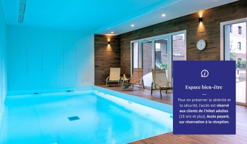 a swimming pool in a house at Les Boréales - Appart'hotel & Restaurant in Rouen