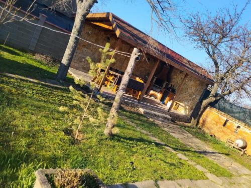 a house with a tree in front of it at къща за гости При Приятели in Nesebar