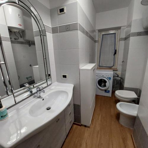 a bathroom with a sink and a toilet at La casina di Silverio in Rio Marina