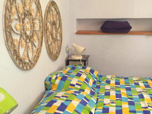 A bed or beds in a room at La Musica del Mare
