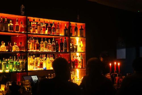 a group of people sitting at a bar at Triple SSS Hotel in Nairobi