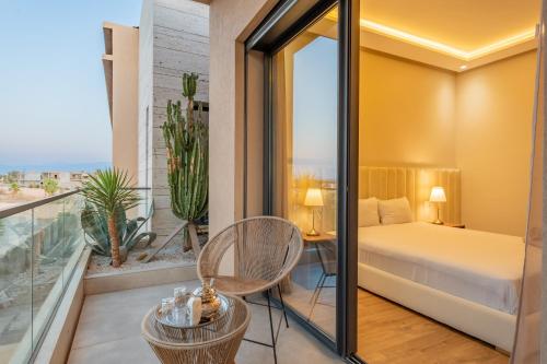 a hotel room with a bed and a balcony at Villa Capella heated pool and cooker in Marrakesh