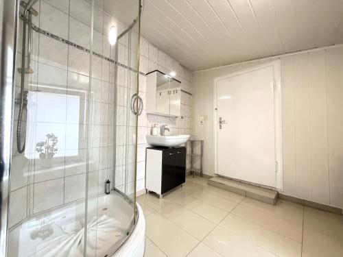 a bathroom with a tub and a sink and a shower at Asia Oase in Arendsee
