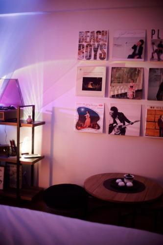 a room with a table and a purple light at MINIMAL SHIMOKITA Stylish Loft or Studio Apt in Tokyo