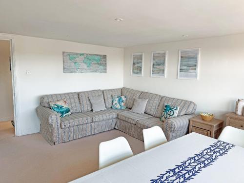 a living room with a couch and a table at Sandbourne in Bournemouth