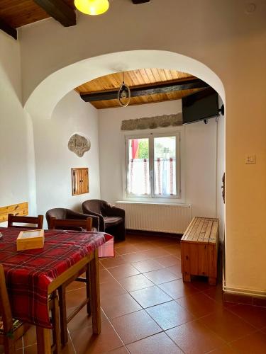a living room with a table and a couch at Da Nonna Laura in Follina