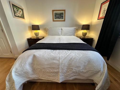 a bedroom with a large white bed with two lamps at Luxury Rooms - St Leonards on Sea - East Sussex in St. Leonards