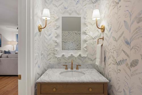 a bathroom with a sink and a mirror at 3026 Fairway One in Seabrook Island