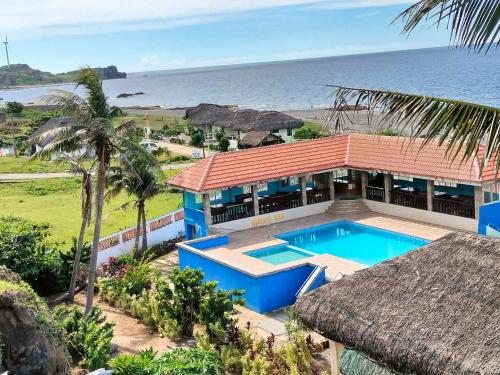 an aerial view of a house with a swimming pool at Amerie Rae Resort in Bangui