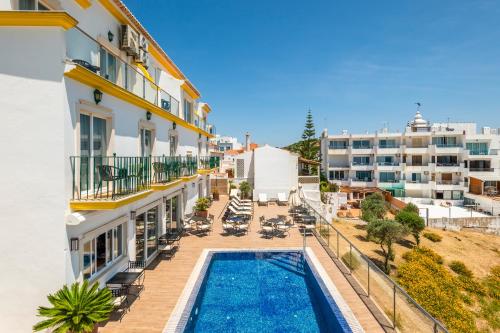 an aerial view of a building with a swimming pool at Vila Sao Vicente Boutique (Adults Only) in Albufeira