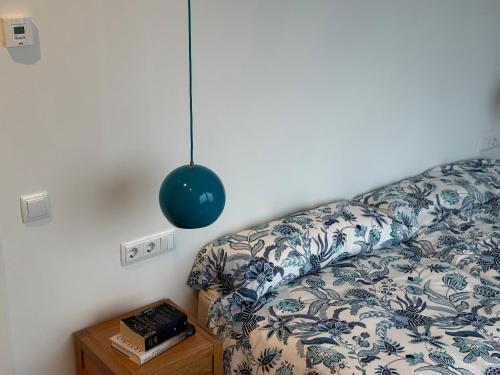 a room with a couch with a pillow and a table at Lar do Mar in Beloso