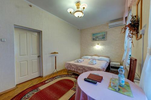 Cama o camas de una habitación en Aleksandria Hotel