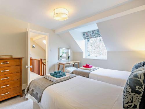 a bedroom with two beds and a window at 2 Bed in Bromyard oc-27478 in Pencombe