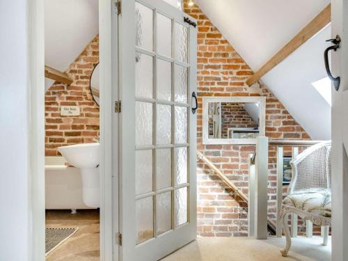 a bathroom with a brick wall at 2 Bed in Ashbourne oc-89339 in Edwalton