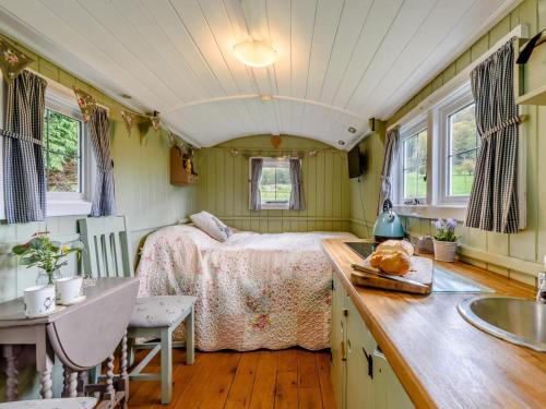 a bedroom with a bed and a sink in a room at 1 Bed in Hereford oc-79576 in Byford