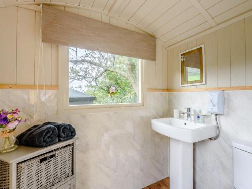 a bathroom with a sink and a window at 1 Bed in Hereford oc-79576 in Byford