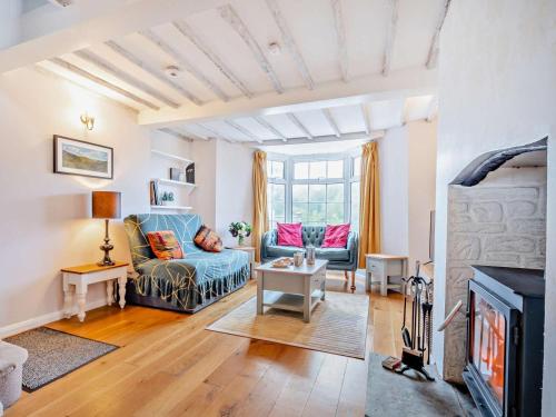 a living room with a couch and a fireplace at 2 Bed in Swindon oc-93489 in Bishopstone