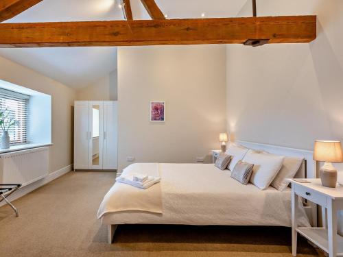 a bedroom with a large bed and a window at 1 Bed in Bucknell oc-94662 in Letton