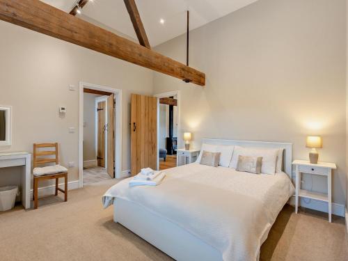 a bedroom with a large white bed in a room at 1 Bed in Bucknell oc-94661 in Letton