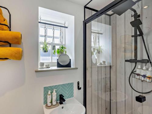 a bathroom with a shower and a sink and a toilet at 1 Bed in Kidderminster oc-94769 in Orleton